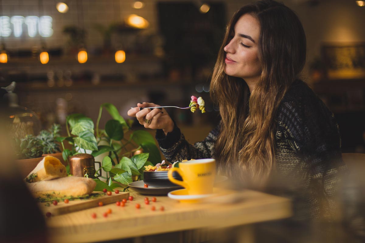 lagunashoresrecovery 7 Ways to Cope with Anxiety Naturally photo of a young woman eating healthy foods