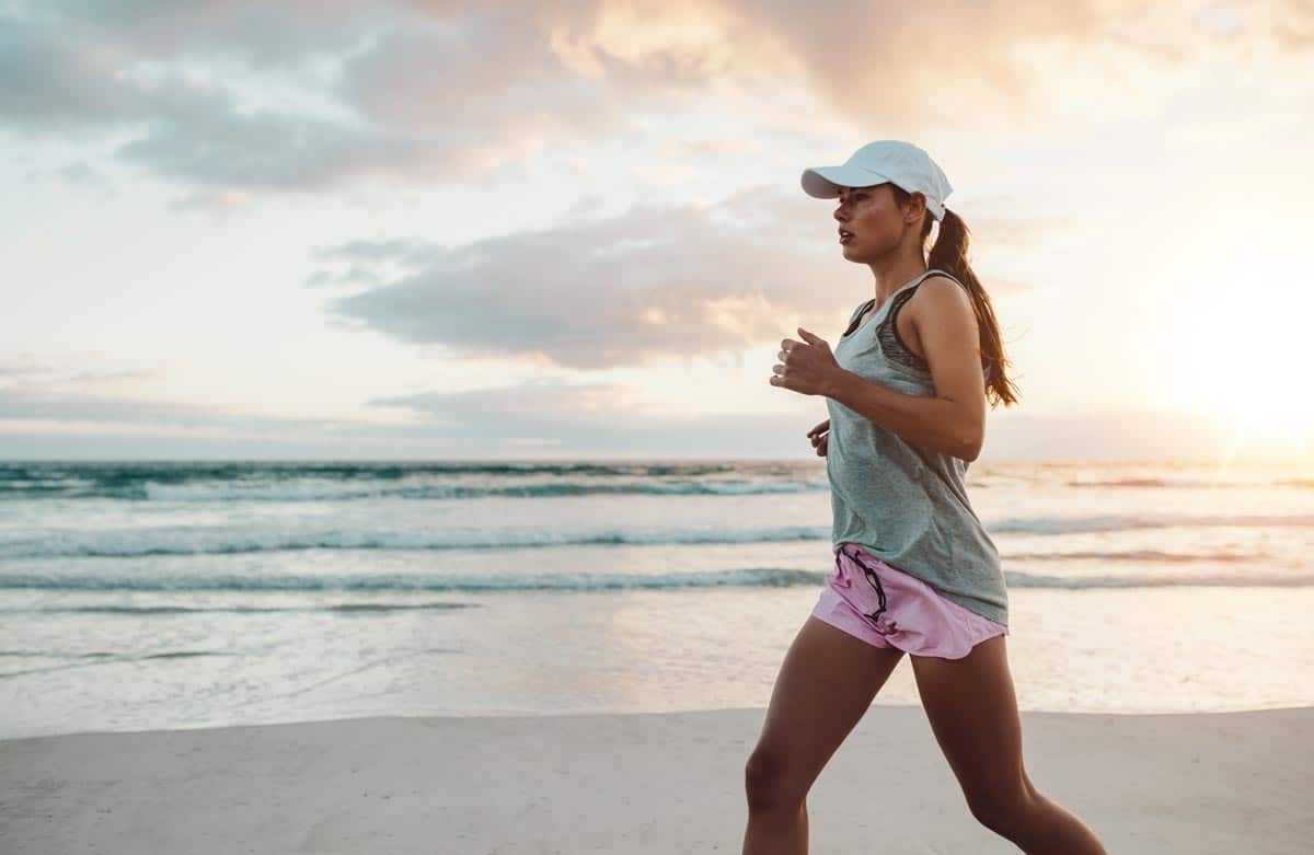laguna shores recovery How to be a Sober Mom photo of a female runner jogging on outdoors on beach