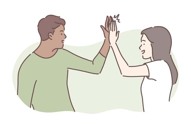 a man and a lady giving themselves a high five
