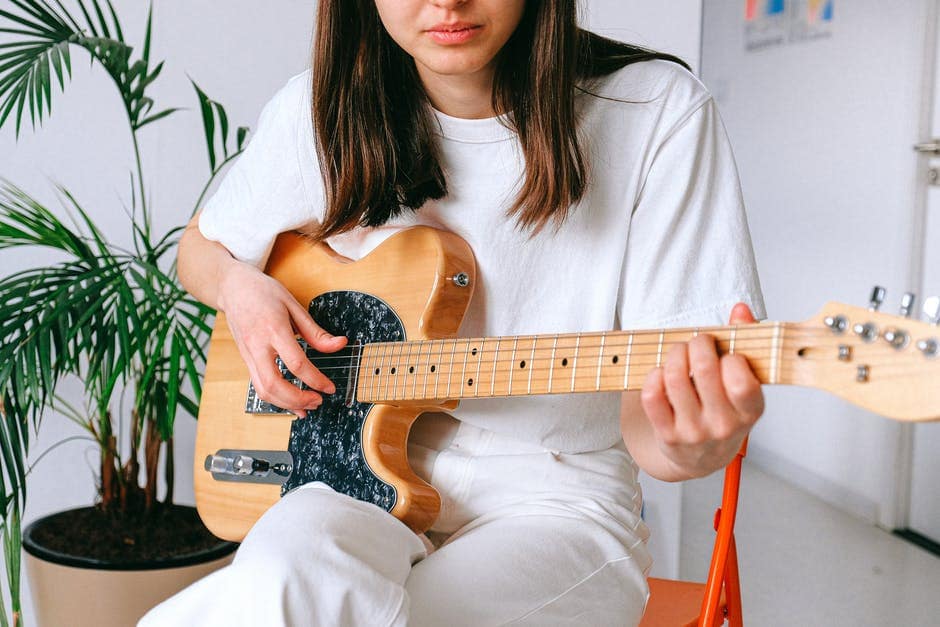 girl playing guitar