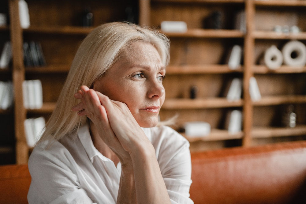 Older woman deep in thought about memory loss