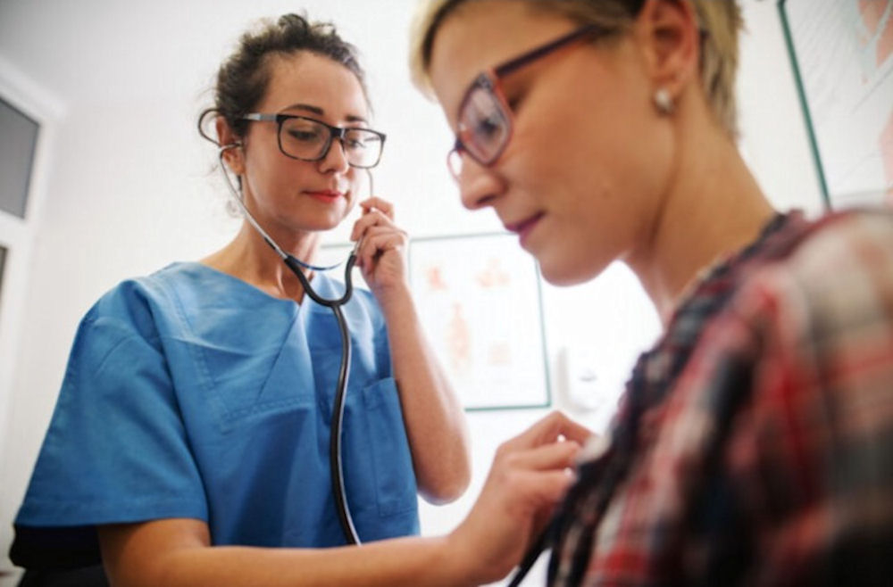 a health expert checking up a patient