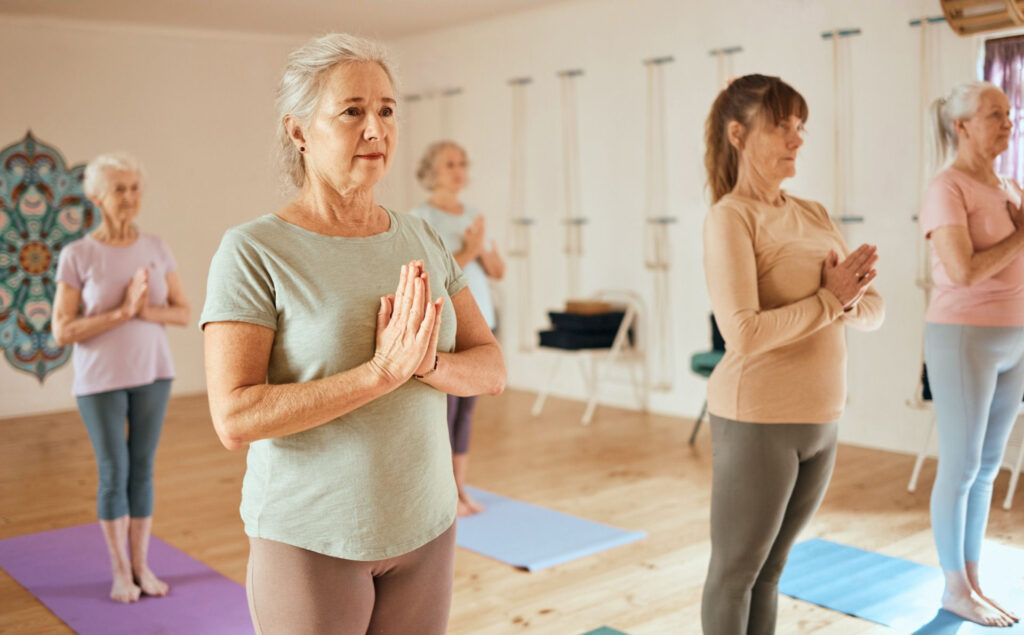 a group of women practicing yoga and mindfulness as part of their recovery