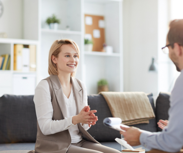 Woman smiling after receiving positive results from anxiety and addiction treatment